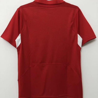 Red Liverpool 2005 champions league final shirt  on a hanger against a white background