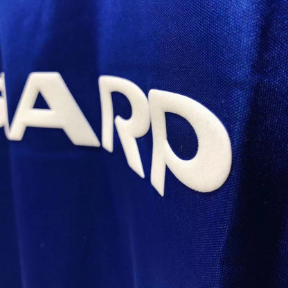 Close-up of a blue Man united 85/86 third shirt with white text on it