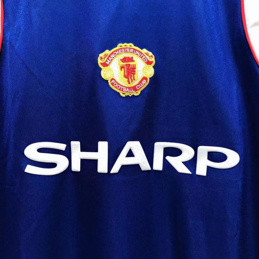 Blue Man united 85/86 third shirt with Manchester United logo and 'Sharp' branding