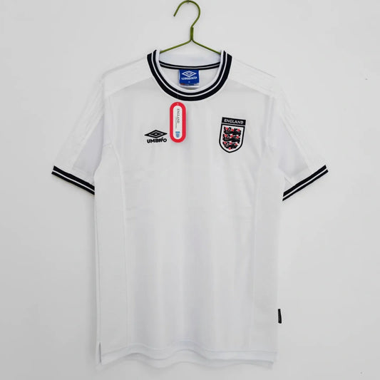White England 2000 home shirt with black accents on a hanger against a white background