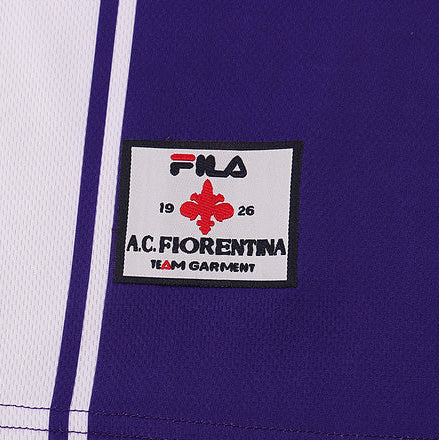 Close-up of a FILA logo on a Fiorentina 99/00 home kids kit  with 'AC Fiorentina' text.