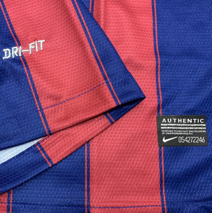 Close-up of a blue and red Barcelona 09/10 home shirt with 'Dri-Fit' and 'Authentic' labels.