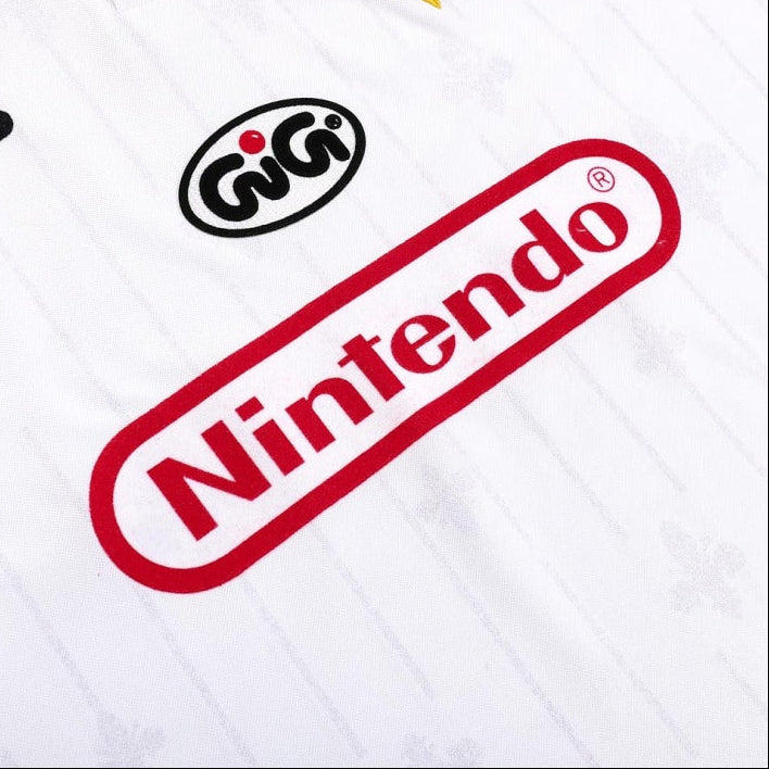 White Fiorentina 97/98 away shirt  with Nintendo logo and other brand logos on a white background