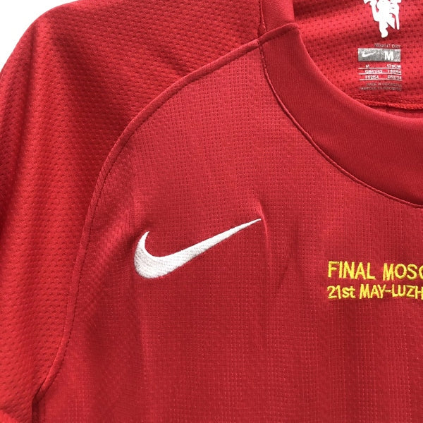 Red Man United 2008 champions league shirt with Nike logo and text on a hanger