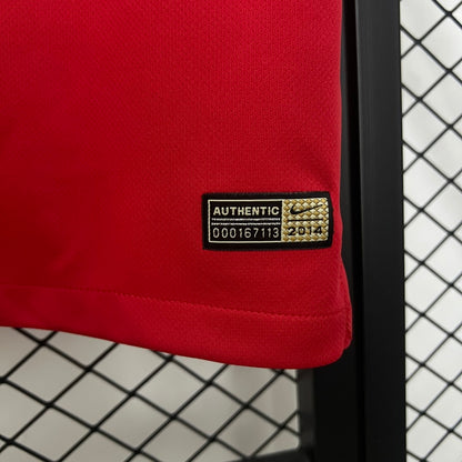 Red USA 2014 away shirt with a visible Nike authenticity label on a grid background