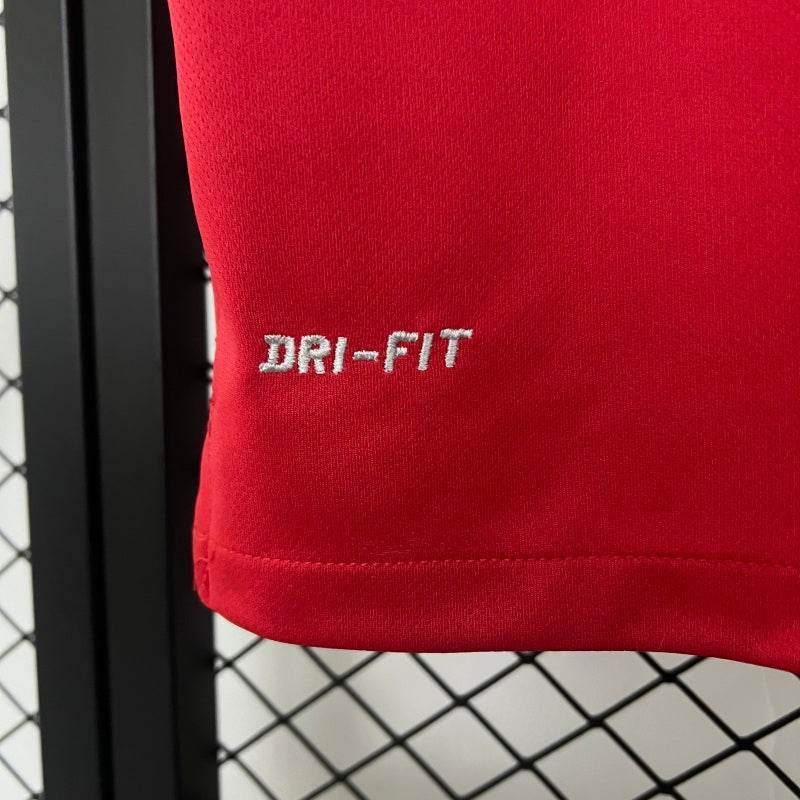 Red USA 2014 away shirt with 'DRI-FIT' embroidery on a black and white checkered background