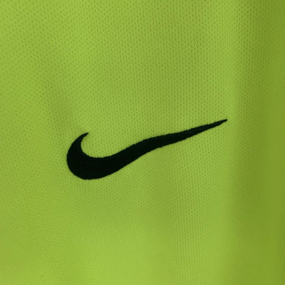 Black Nike logo on a green Barcelona 05/06 long sleeve away shirt