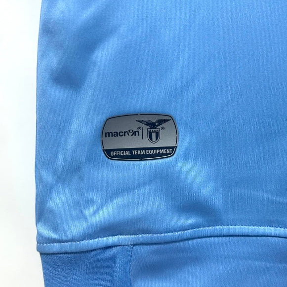 Blue Lazio 14/15 fourth shirt with a Macron logo on a white background