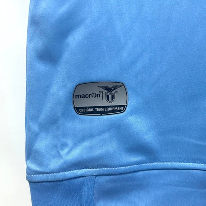 Blue Lazio 14/15 fourth shirt with a Macron logo on a white background