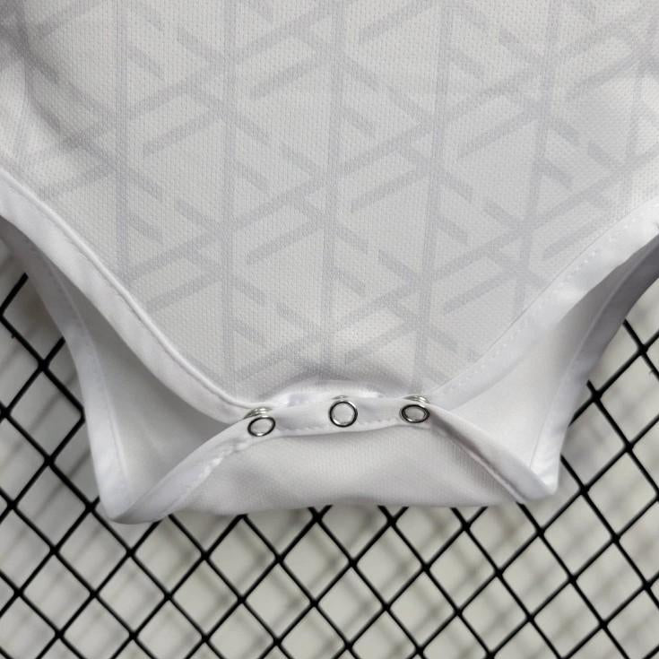 White Germany 2024 home baby onesie  with a textured pattern on a black grid background