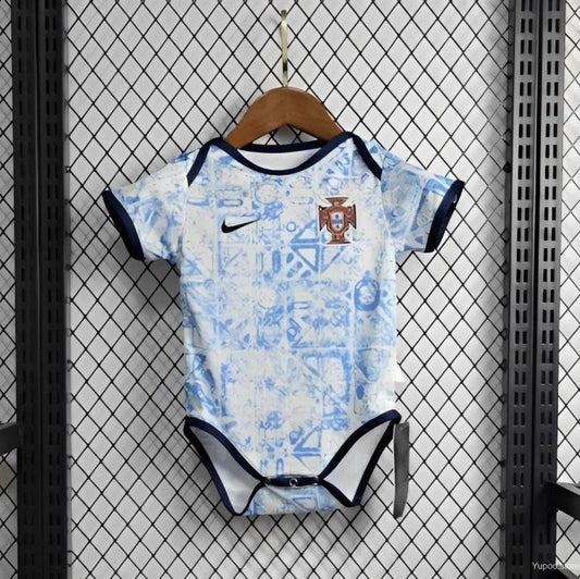 Portugal 2021 away baby onesie  with sports team logo on a hanger against a grid background