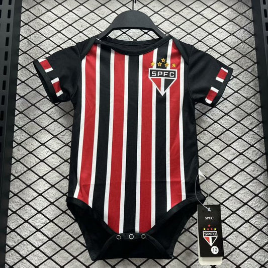 Black and red striped São Paulo 2024 away baby onesie  with SPFC logo on a hanger against a grid background