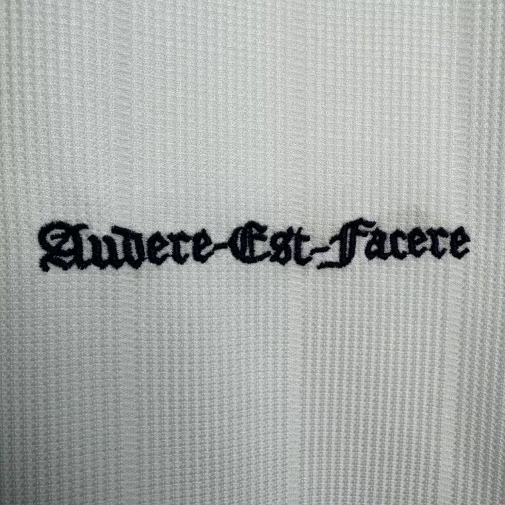Text 'Audere Est Facere' on a textured Tottenham 97-99 long sleeve home shirt