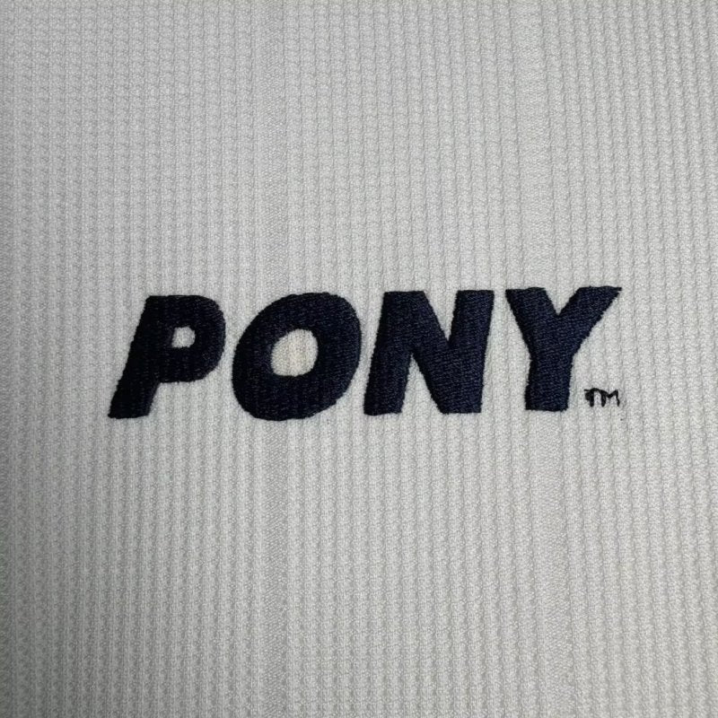 Close-up of a Tottenham 97-99 long sleeve home shirt with 'PONY' logo.