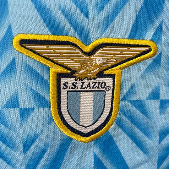 S.S. Lazio logo patch on a blue patterned Lazio 91/92 home shirt