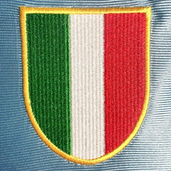 Embroidered patch with green, white, and red stripes on a blue Napoli 90/91 home 2nd shirt
