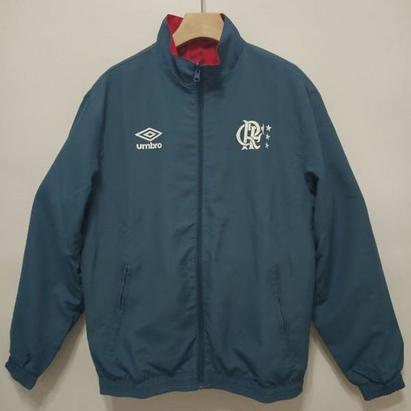 Blue Flamengo 95/96 windbreaker jacket with Umbro logo on a hanger against a plain background