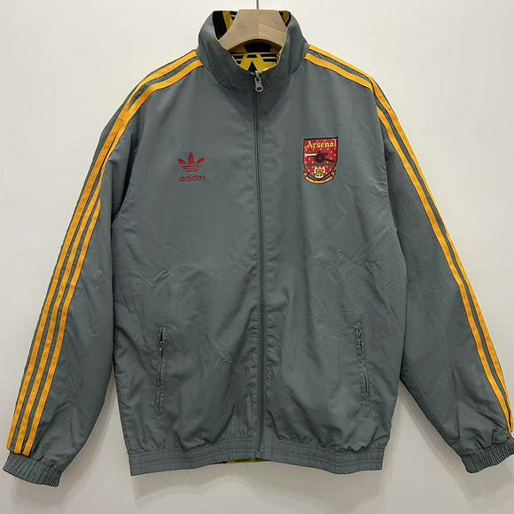 Gray Arsenal 91-93 away windbreaker jacket with yellow stripes and Adidas logo on a white background
